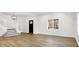 Bright living room featuring hardwood floors and a staircase at 2202 Bellefontaine St, Indianapolis, IN 46205