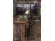 Rustic bar area with farmhouse-style seating and fire pit view at 2723 E 200 S, Franklin, IN 46131