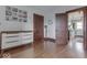 Bedroom with hardwood floors, dresser, and view into the kitchen at 2723 E 200 S, Franklin, IN 46131