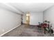 Finished basement area with gray carpeting and storage at 3502 Oak Tree Cir, Indianapolis, IN 46227