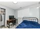 Bedroom with a home office and a blue comforter at 3502 Oak Tree Cir, Indianapolis, IN 46227