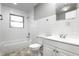 Bathroom with white tiled walls, bathtub, and vanity at 3920 N Layman Ave, Indianapolis, IN 46226