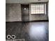 Living Room with dark hardwood floors and stone wall at 400 W Southport Rd, Indianapolis, IN 46217