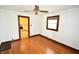 Hardwood floors and ceiling fan in this spacious dining room at 5064 Ford St, Indianapolis, IN 46224