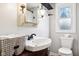 Updated bathroom with a pedestal sink and shower at 507 E 5Th St, Sheridan, IN 46069