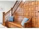 Wooden staircase with built-in bench and decorative wood paneling at 507 E 5Th St, Sheridan, IN 46069