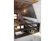 Open shelving unit in an attic space with metal and wood accents at 5383 Wells Hill Rd, Nineveh, IN 46164