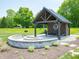 Relaxing community pavilion with picnic tables and grills at 6196 Granby Dr, Whitestown, IN 46075