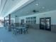 Covered patio area with tables and chairs near the pool at 6196 Granby Dr, Whitestown, IN 46075