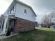 Side view of house showcasing brick and vinyl siding at 7322 S Sherman Dr, Indianapolis, IN 46237