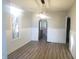 Dining room with hardwood floors and archway to the kitchen at 802 S Harrison St, Alexandria, IN 46001