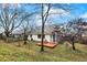 Spacious backyard with deck and mature trees at 8627 Champions Dr, Indianapolis, IN 46256