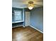 Charming bedroom with hardwood floors, neutral walls, and ceiling fan at 927 Stockton St, Indianapolis, IN 46260