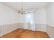 Simple dining room featuring hardwood floors and a chandelier at 9617 Lincoln Blvd, Carmel, IN 46280