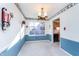 Charming dining room with blue walls and a view of the kitchen at 9617 Lincoln Blvd, Carmel, IN 46280