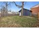 Large backyard with detached garage and wooden fence at 1037 Jefferson Ave, Indianapolis, IN 46201