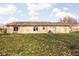 Rear view of the house showcasing a large yard at 113 Creek Wood Dr, Greenfield, IN 46140