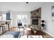 Cozy living room with fireplace and large clock at 113 Creek Wood Dr, Greenfield, IN 46140