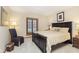 Bedroom with a king-size bed and large window with blinds at 12321 Brompton Rd, Carmel, IN 46033