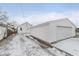 Detached garage with driveway, in winter setting at 1506 E Bradbury Ave, Indianapolis, IN 46203