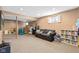 Finished basement playroom with slide, toys, couch, bookcase, and a TV at 17849 Grassy Knoll Dr, Westfield, IN 46074