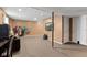 Finished basement with a couch, TV, computer desk, clothes rack, and storage at 17849 Grassy Knoll Dr, Westfield, IN 46074