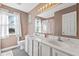 Bathroom with double vanity, white cabinetry, and a colorful shower curtain at 17849 Grassy Knoll Dr, Westfield, IN 46074