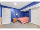 Blue bedroom in the finished basement with carpet flooring and white doors at 17849 Grassy Knoll Dr, Westfield, IN 46074