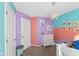 bedroom featuring pink, purple, and teal walls, white dresser, and bunk beds at 17849 Grassy Knoll Dr, Westfield, IN 46074