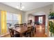 Dining room with a wooden table and chairs and view to living area at 17849 Grassy Knoll Dr, Westfield, IN 46074