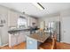 Kitchen featuring white cabinetry, an island, and stainless steel appliances at 17849 Grassy Knoll Dr, Westfield, IN 46074