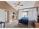Main bedroom featuring canopy bed, carpeted floors, and natural light at 17849 Grassy Knoll Dr, Westfield, IN 46074