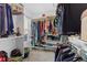 Walk-in closet with built-in shelving, hanging rods, and window at 17849 Grassy Knoll Dr, Westfield, IN 46074