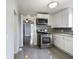 Modern kitchen with stainless steel appliances and white cabinets at 1814 Fairview St, Anderson, IN 46016