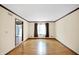 Living room with hardwood floors and access to other rooms at 2025 Hamilton Ln, Carmel, IN 46032