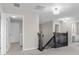 Upper hall with neutral walls and carpet, showcasing stairs and doors at 2291 Creek Bank Dr, Columbus, IN 47201