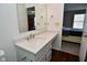 Simple bathroom with white vanity and a view into bedroom at 2473 Windsor Pl, Plainfield, IN 46168