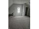 Unfinished attic bedroom with gray carpeting at 2702 Boulevard Pl, Indianapolis, IN 46208