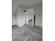 Unfinished attic bedroom with gray carpeting and open doorway at 2702 Boulevard Pl, Indianapolis, IN 46208