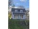 Two-story house needing renovation, with brown roof and small lawn at 2702 Boulevard Pl, Indianapolis, IN 46208