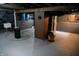 Unfinished basement with plumbing, water heater, and electrical panel at 3235 Adams St, Indianapolis, IN 46218