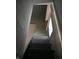 Unfinished basement with access via wooden stairs at 3235 Adams St, Indianapolis, IN 46218