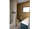 Full bathroom with teal vanity and white toilet at 3235 Adams St, Indianapolis, IN 46218