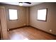 Well-lit bedroom with hardwood floors and two windows at 3235 Adams St, Indianapolis, IN 46218