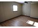 Spacious bedroom with hardwood floors and neutral walls at 3235 Adams St, Indianapolis, IN 46218