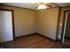 Bright bedroom featuring hardwood floors and ceiling fan at 3235 Adams St, Indianapolis, IN 46218