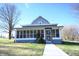 House exterior with screened porch and walkway at 3235 Adams St, Indianapolis, IN 46218