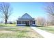 House exterior with screened porch and walkway at 3235 Adams St, Indianapolis, IN 46218