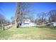 House exterior with large yard and additional building at 3235 Adams St, Indianapolis, IN 46218
