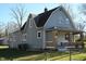 Side view of a charming gray house with a gabled roof at 3235 Adams St, Indianapolis, IN 46218
